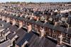 Aerial view of old terraced houses on back to back streets in the suburbs of a large UK city in the North of England