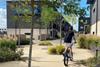 Child on a bike on a housing development