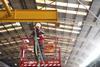 ilke Homes factory worker on scissor lift