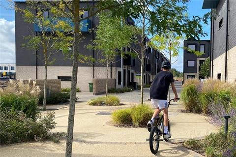Child on a bike on a housing development