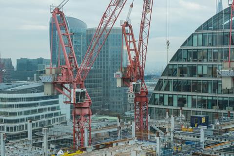 Tower cranes at the Sir Robert Mcalpine Construction site above Moorfields tube station